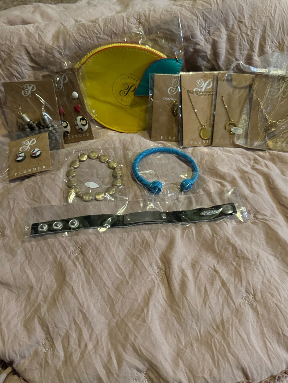 NEW. Plunder bundle. One lemon zip ouch and 10 pieces of plunder jewelry